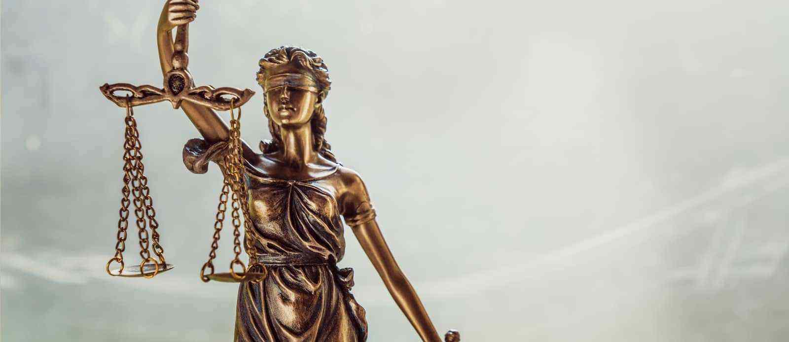 A statue of Lady Justice holding scales